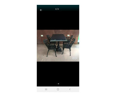 Cast iron table and chairs - Image 1/2