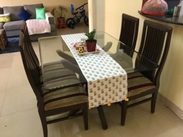 Glass top 4-seater dining table of teak wood Bangalore - Buy Sell Used