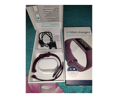 Headphone and Fitbit charger - Image 1/6