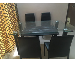 Glass top dining table with chairs in good condition for sale - Image 1/4
