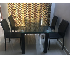 Glass top dining table with chairs in good condition for sale - Image 2/4