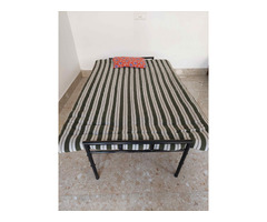 Folding ply-wood bed with cotton mattress, pillow and a folding table - Image 3/4