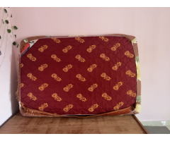 Double or full-size bed with foam mattress