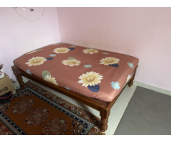 Double or full-size bed with foam mattress