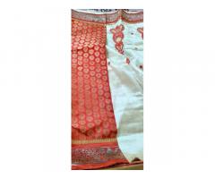Its a Only one time used saree Cream and Red colour cobination